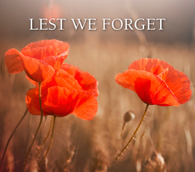 Image of poppies with wording "Lest We Forget"