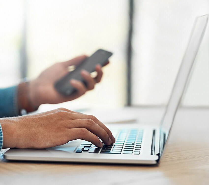 man typing on computer