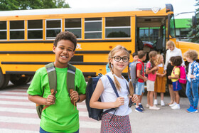 Students beside school bus